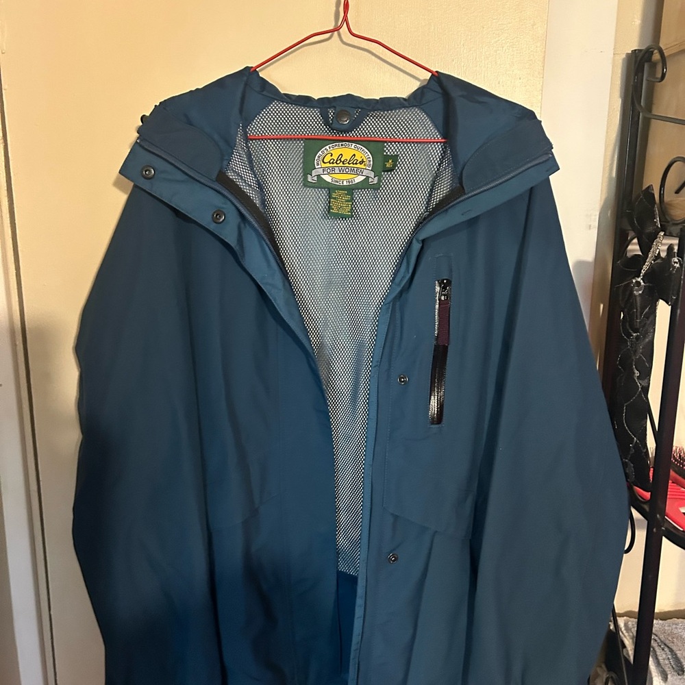 The Cabellas Women's Blue Zip Up Hooded Rain Jacket in size M